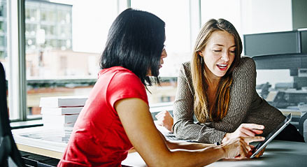 two-female_life_care_planners_work_on_tablet